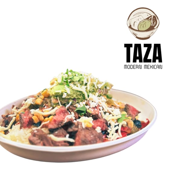A Taza Modern Mexican steak bowl with rice, corn, beans, guacamole, and cheese.